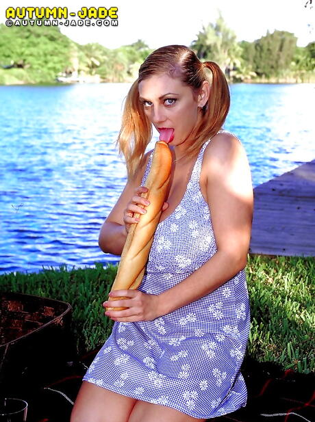 Appealing american milf Autumn Jade in sexy skirt revealing big knockers and masturbating with sex toy outdoor