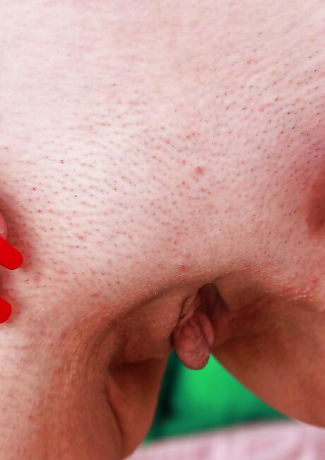 Shapely blond aged Janotova exhibits her ass in sexy undies and masturbates 