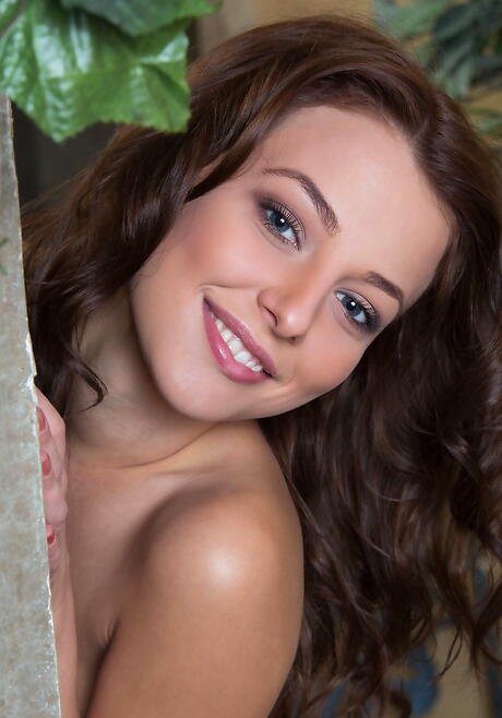 Shapely brunette teen Nikia A exposes tiny tits and butt 