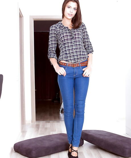 Gracile youthful Barbi in tight jeans reveals small tits and spreads her legs 